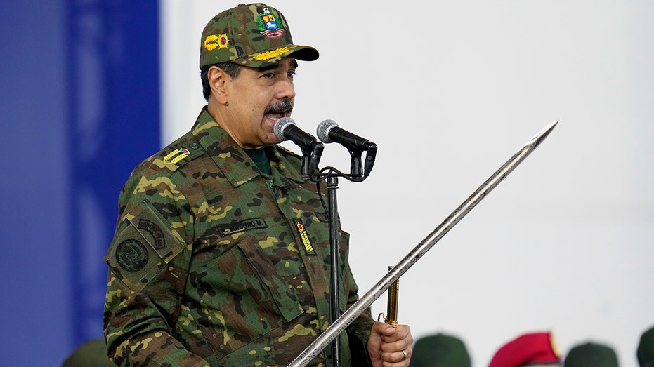 Maduro brandishes sword at rally as he rails against 'imperialist aggression' amid rising tensions with US